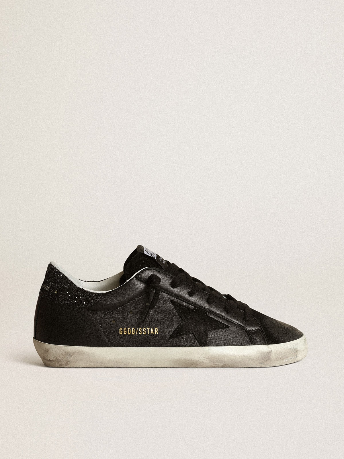 Nappa nera con stella in suede nero e talloncino in glitter neri