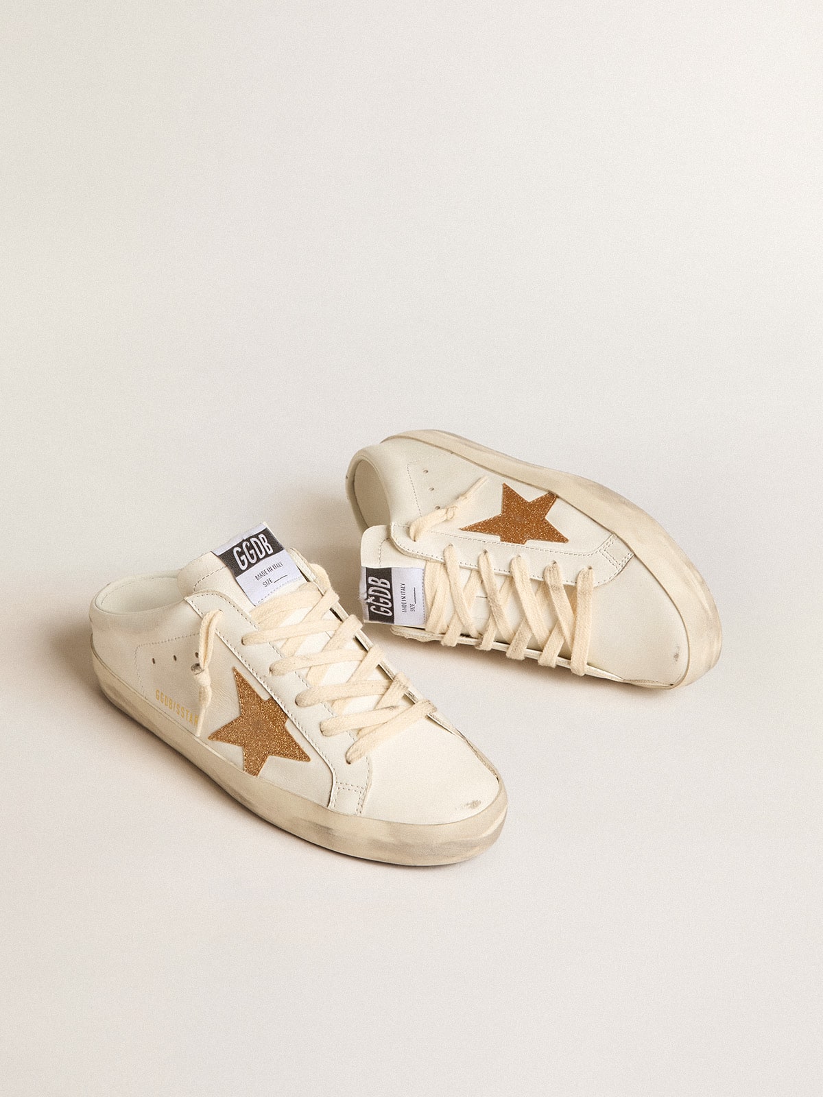 Sabot in pelle con stella in glitter oro plastificati