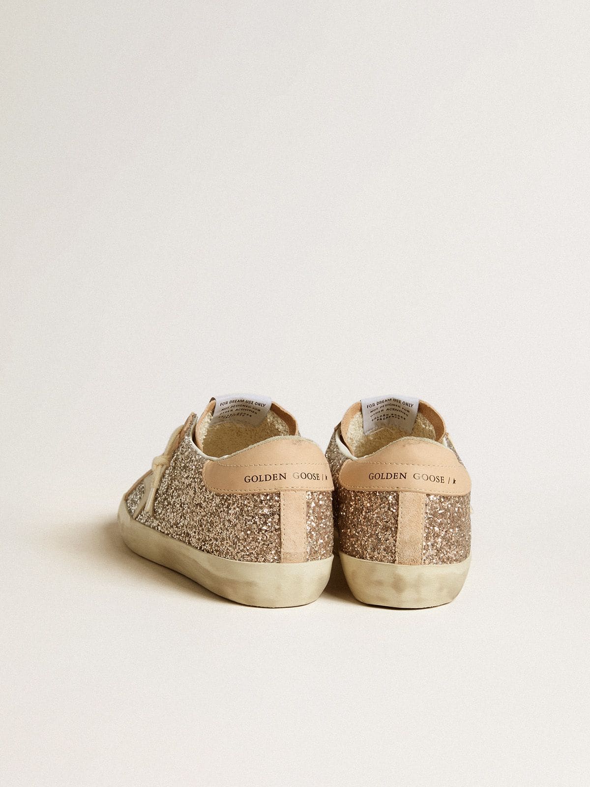 Glitter argento con stella e talloncino in pelle
