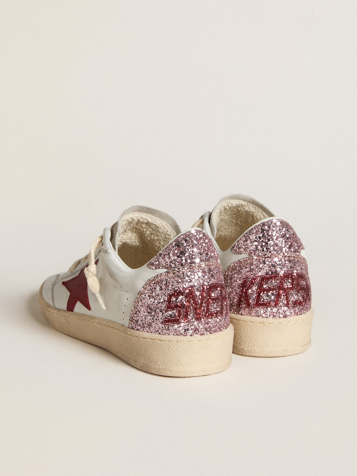LTD con stella in pelle rossa e talloncino in glitter rosa