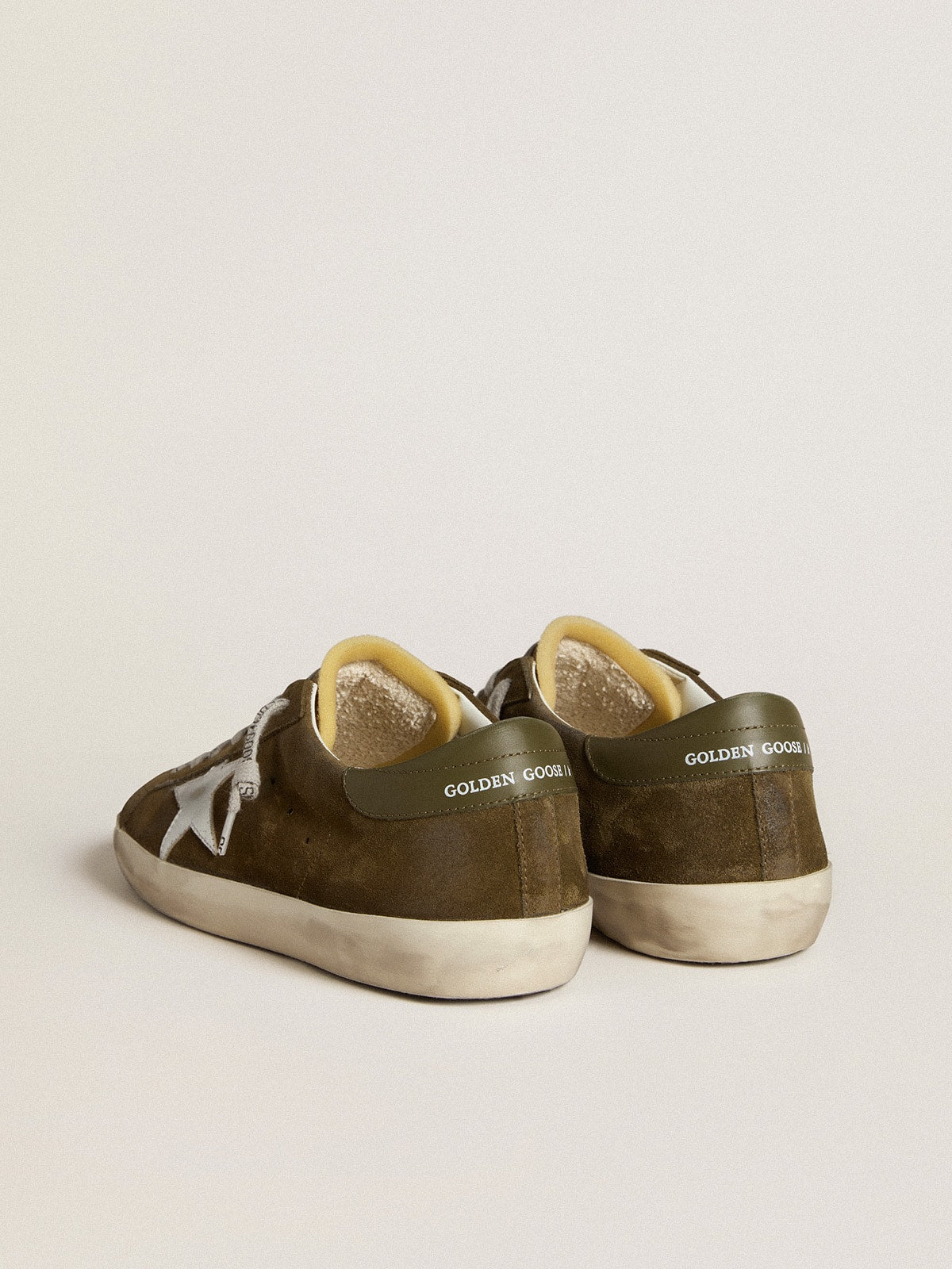 LTD in suede con stella in pelle laminata e talloncino in pelle