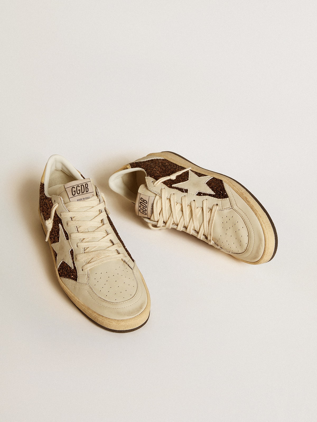 Glitter con stella in pelle e talloncino in pelle laminata