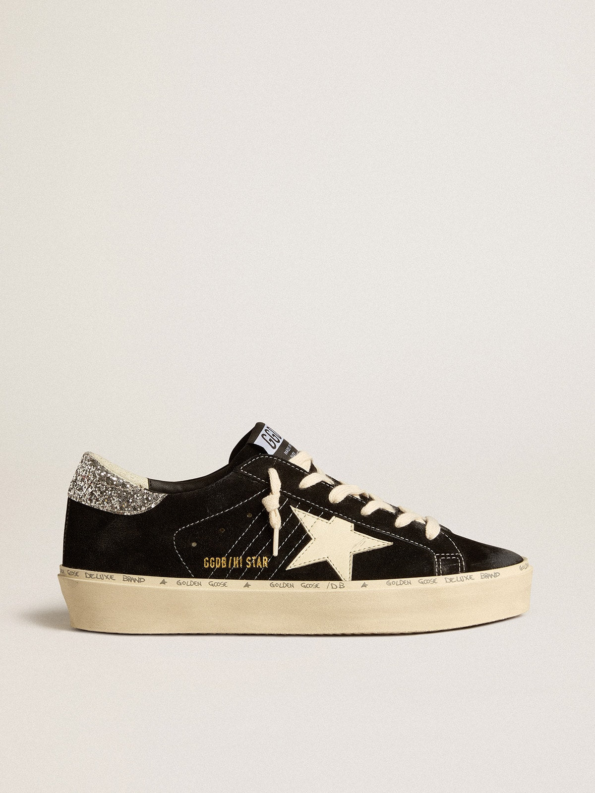 Pelle nera con talloncino in glitter argento